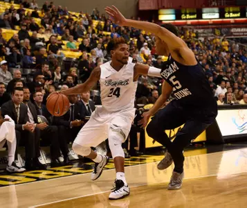 Nov 16, 2015; Long Beach, CA, USA; Long Beach State 49ers guard Travis Hammonds (left) moves the ball defended by Brigham Young Cougars guard Jordan Chatman (right) during the second half at The Pyramid. The Long Beach State 49ers won 66-65. Mandatory Credit: Kelvin Kuo-USA TODAY Sports