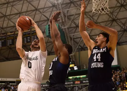 Nov 16, 2015; Long Beach, CA, USA; Long Beach State 49ers forward Gabe Levin (left) attempts a shot defended by Brigham Young Cougars forward Jamal Aytes (center) during the second half at The Pyramid. The Long Beach State 49ers won 66-65. Mandatory Credit: Kelvin Kuo-USA TODAY Sports