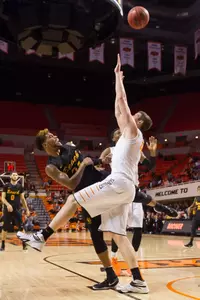 Oklahoma State Cowboys forward Mitchell Solomon (41) blocks the shot by Long Beach State 49ers guard Travis Hammonds (24) during the first half at Gallagher-Iba Arena.
