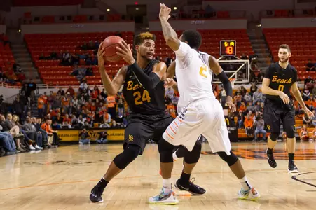 Long Beach State 49ers guard Travis Hammonds (24) dribbles the ball as Oklahoma State Cowboys guard Tyree Griffin (2) defends during the first half at Gallagher-Iba Arena.