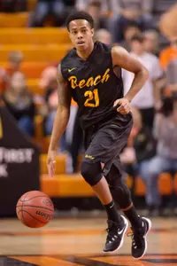 Long Beach State 49ers guard Justin Bibbins (21) dribbles the ball against the Oklahoma State Cowboys during the first quarter at Gallagher-Iba Arena.
