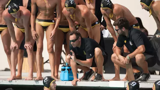 Head Coach Gavin Arroyo talks to the team during a timeout.