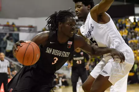 Dec 1, 2015; Long Beach, CA, USA; San Diego State Aztecs forward Angelo Chol (left) moves the ball defended by Long Beach State 49ers forward Mason Riggins (right) during the first half at The Pyramid. Mandatory Credit: Kelvin Kuo-USA TODAY Sports