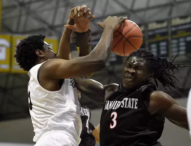 Dec 1, 2015; Long Beach, CA, USA; Long Beach State 49ers forward Mason Riggins (left) and San Diego State Aztecs forward Angelo Chol (right) battle for the rebound during the first half at The Pyramid. Mandatory Credit: Kelvin Kuo-USA TODAY Sports