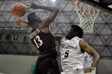 Dec 1, 2015; Long Beach, CA, USA; San Diego State Aztecs forward Winston Shepard (13) attempts a shot as he is fouled by Long Beach State 49ers forward Mason Riggins (5) during the first half at The Pyramid. Mandatory Credit: Kelvin Kuo-USA TODAY Sports