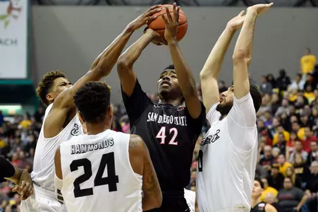 Dec 1, 2015; Long Beach, CA, USA; San Diego State Aztecs guard Jeremy Hemsley (42) attempts a shot defended by Long Beach State 49ers forward Gabe Levin (right) Long Beach State 49ers guard Travis Hammonds (24) and Long Beach State 49ers guard Nick Faust (left) during the first half at The Pyramid. Mandatory Credit: Kelvin Kuo-USA TODAY Sports