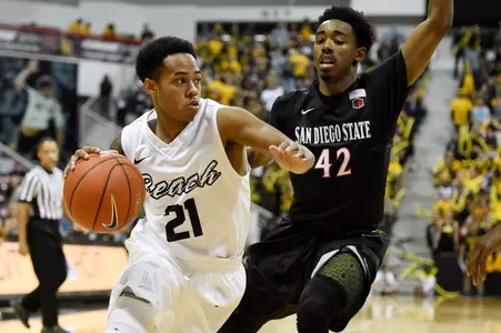 Dec 1, 2015; Long Beach, CA, USA; Long Beach State 49ers guard Justin Bibbins (21) dribbles the ball as San Diego State Aztecs guard Jeremy Hemsley (42) defends during the second half at The Pyramid. The Aztecs won 76-72. Mandatory Credit: Kelvin Kuo-USA TODAY Sports
