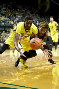Travis Hammonds and Oregon Ducks forward Chris Boucher (25) scramble for a lose ball during a game at Matthew Knight Arena. -USA TODAY Sports