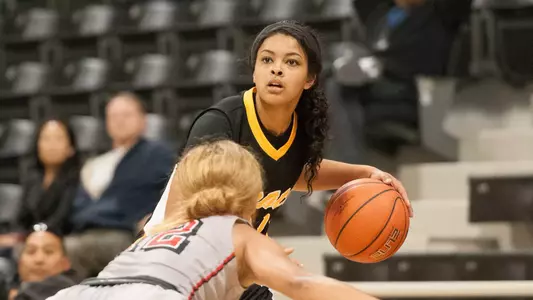 Junior guard Raven Benton scored a career-high 31 points to lead the Beach to a 67-63 win over UNLV.<Br><i>(Photo by John Fajardo)</i>