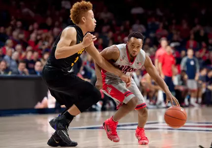Arizona Wildcats guard Parker Jackson-Cartwright dribbles the ball as Long Beach State 49ers guard Noah Blackwell defends during the first half at McKale Center. Credit: Casey Sapio-USA TODAY Sports