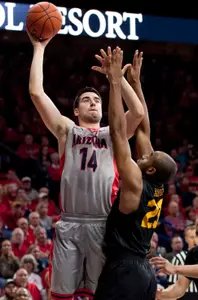 Arizona Wildcats center Dusan Ristic shoots the ball as 49ers forward Roschon Prince defends during the first half at McKale Center. Credit: Casey Sapio-USA TODAY Sports