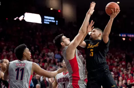 49ers guard A.J. Spencer shoots the ball as Arizona Wildcats center Dusan Ristic defends during the second half at McKale Center. Credit: Casey Sapio-USA TODAY Sports
