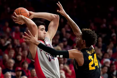 Arizona Wildcats center Dusan Ristic is defended by 49ers guard Travis Hammonds during the second half at McKale Center. Credit: Casey Sapio-USA TODAY Sports