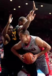 Arizona Wildcats forward Ryan Anderson is defended by 49ers forward Roschon Prince and guard Branford Jones during the second half at McKale Center. Credit: Casey Sapio-USA TODAY Sports