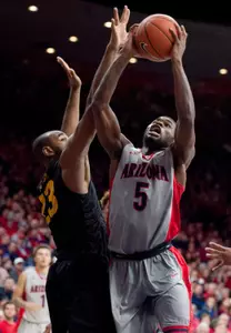 Arizona Wildcats guard Kadeem Allen shoots the ball as 49ers forward Roschon Prince defends during the second half at McKale Center. Credit: Casey Sapio-USA TODAY Sports