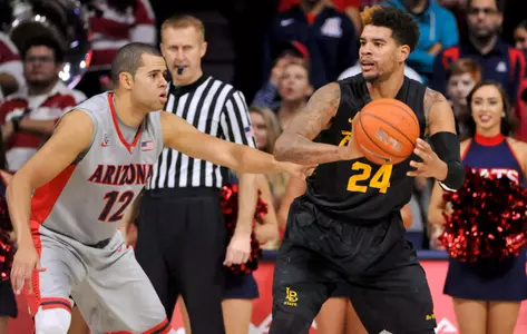 49ers guard Travis Hammonds looks to pass as Arizona Wildcats forward Ryan Anderson defends during the second half at McKale Center. Credit: Casey Sapio-USA TODAY Sports