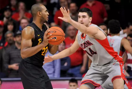 49ers forward Roschon Prince looks to pass as Arizona Wildcats center Dusan Ristic defends during the second half at McKale Center. Credit: Casey Sapio-USA TODAY Sports