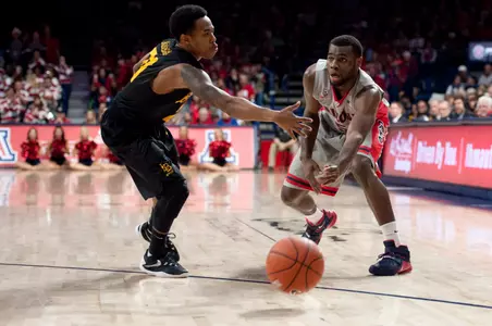 Arizona Wildcats guard Kadeem Allen passes around 49ers guard Justin Bibbins during the second half at McKale Center. Credit: Casey Sapio-USA TODAY Sports