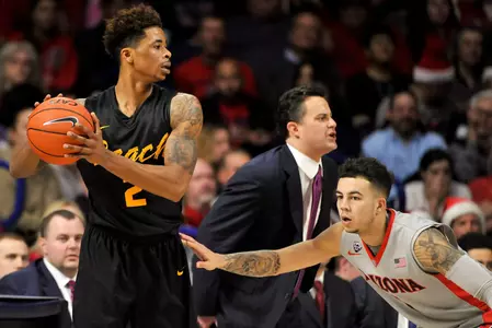 49ers guard Nick Faust looks to pass the ball as Arizona Wildcats guard Gabe York defends during the first half at McKale Center. Credit: Casey Sapio-USA TODAY Sports