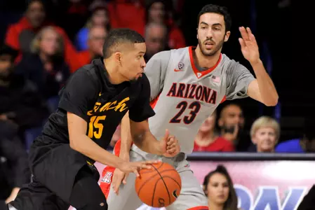 49ers guard A.J. Spencer dribbles the ball as Arizona Wildcats forward Mark Tollefsen defends during the first half at McKale Center. Credit: Casey Sapio-USA TODAY Sports