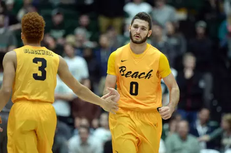 Dec 3, 2015; Fort Collins, CO, USA; Long Beach State 49ers forward Gabe Levin (0) celebrates his points made with guard Noah Blackwell (3). Credit: Ron Chenoy-USA TODAY Sports