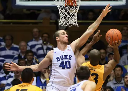 Dec 30, 2015; Durham, NC, USA; Long Beach State 49ers forward Roschon Prince (23) shoots against Duke Blue Devils center Marshall Plumlee (40). Credit: Mark Dolejs-USA TODAY Sports