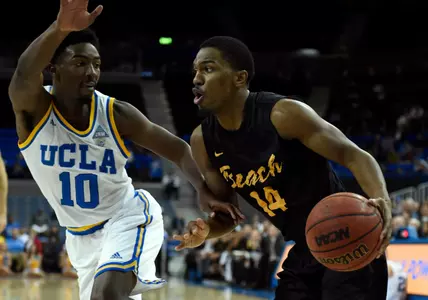 49ers guard Branford Jones drives to the basket against UCLA Bruins guard Isaac Hamilton during the game at Pauley Pavilion. Credit: Richard Mackson-USA TODAY Sports