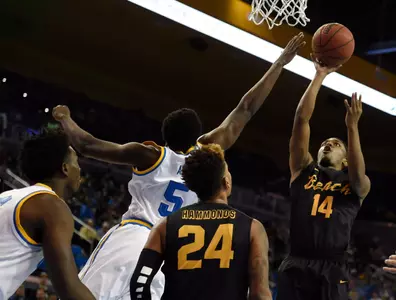 49ers guard Branford Jones shoots over UCLA Bruins guard Prince Ali during the game at Pauley Pavilion. Credit: Richard Mackson-USA TODAY Sports