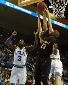 49ers forward Roschon Prince battles for the ball with UCLA Bruins guard Aaron Holiday during the game at Pauley Pavilion. Credit: Richard Mackson-USA TODAY Sports