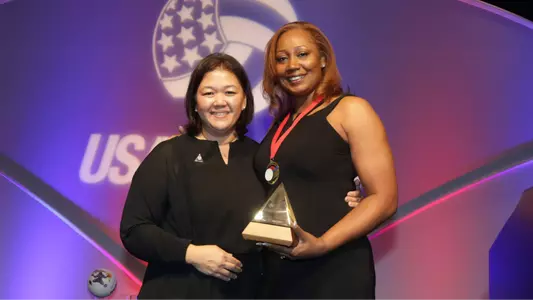 Cross-Battle receiving her award.