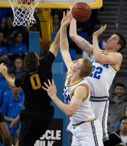 Nov 20, 2016; Los Angeles, CA, USA; Long Beach State 49ers forward Gabe Levin (0) battles UCLA Bruins forward TJ Leaf (right) and center Thomas Welsh (40) for the rebound. Kelvin Kuo-USA TODAY Sports