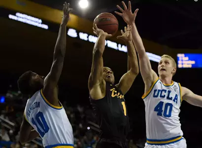 Nov 20, 2016; Los Angeles, CA, USA; Long Beach State 49ers guard Evan Payne (center) attempts a shot defended by UCLA Bruins center Thomas Welsh (40) and guard Isaac Hamilton (10). Kelvin Kuo-USA TODAY Sports