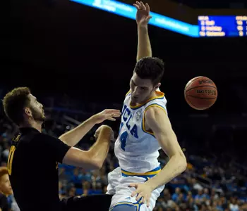 Nov 20, 2016; Los Angeles, CA, USA; Long Beach State 49ers forward Gabe Levin (0) blocks a shot by UCLA Bruins forward Gyorgy Goloman (14). Kelvin Kuo-USA TODAY Sports