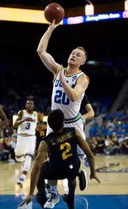 Nov 20, 2016; Los Angeles, CA, USA; Long Beach State 49ers guard Loren Jackson (2) falls after taking a charge from UCLA Bruins guard Bryce Alford (20). Kelvin Kuo-USA TODAY Sports
