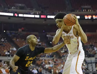 Dec 10, 2016; Austin, TX, USA; Long Beach State 49ers forward Roschon Prince (23) guards Texas Longhorns forward Jarrett Allen (31). Sean Pokorny-USA TODAY Sports