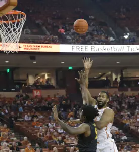 Dec 10, 2016; Austin, TX, USA;  Texas Longhorns forward Shaquille Cleare (32) shoots the ball against Long Beach State 49ers forward Mason Riggins (5). Sean Pokorny-USA TODAY Sports