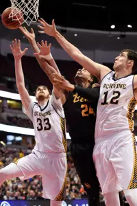 Long Beach State guard Travis Hammonds (center) attempts a shot while UC Irvine Anteaters forward Ioannis Dimakopoulos (12) and forward Mike Best (33) defend. Kelvin Kuo-USA TODAY Sports