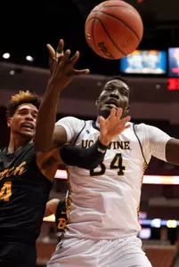 Anteaters center Mamadou Ndiaye (34) and Long Beach State Travis Hammonds (left) battle for the ball during the second half during the Big West conference tournament at Honda Center. The Long Beach State 49ers won 77-72. Mandatory Credit: Kelvin Kuo-USA TODAY Sports