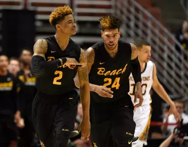 49ers guard Nick Faust (2) celebrates a shot in front of Long Beach State 49ers guard Travis Hammonds (24). Kelvin Kuo-USA TODAY Sports