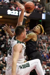 49ers guard Nick Faust attempts a shot while defended by Hawaii Rainbow Warriors center Stefan Jovanovic during the first half in the championship game of the Big West conference tournament at Honda Center. Credit: Kelvin Kuo-USA TODAY Sports