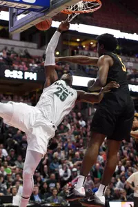 Hawaii Rainbow Warriors forward Michael Thomas is unable to complete a shot as he is defended by 49ers forward Mason Riggins during the second half in the championship game of the Big West conference tournament at Honda Center. Credit: Kelvin Kuo-USA TODAY Sports
