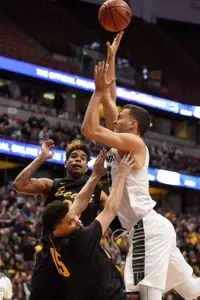 Hawaii Rainbow Warriors forward Stefan Jankovic attempts a shot while defended by 49ers guard A.J. Spencer during the second half in the championship game of the Big West conference tournament at Honda Center. Credit: Kelvin Kuo-USA TODAY Sports