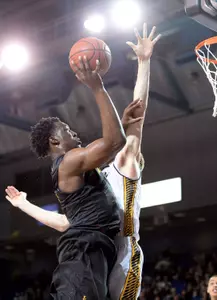 49ers forward Temidayo Yussuf (4) shoots the ball over UC Irvine Anteaters forward Tommy Rutherford (42) during the second half of the game at Bren Events Center. Credit: Orlando Ramirez-USA TODAY Sports
