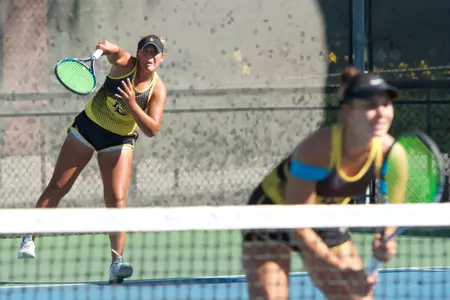Senior Lena Pacholski and sophomore Natalia Munoz after winning the Flight A doubles title on Sunday at the Beach Tennis Fall Tournament.