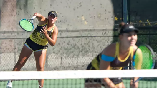 Senior Lena Pacholski and sophomore Natalia Munoz after winning the Flight A doubles title on Sunday at the Beach Tennis Fall Tournament.
