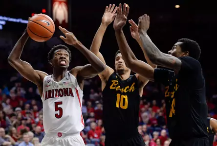 Nov 29, 2017; Tucson, AZ, USA; Arizona Wildcats guard Brandon Randolph (5) looks to shoot the ball as Long Beach State 49ers guard Bryan Alberts (10) and guard KJ Byers (right) defend during the second half at McKale Center. Mandatory Credit: Casey Sapio-USA TODAY Sports