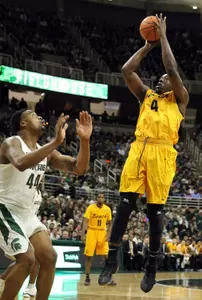49ers forward Temidayo Yussuf (4) shoots over Michigan State Spartans forward Nick Ward (44)