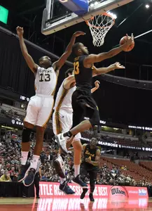 Mar 10, 2017; Anaheim, CA, USA; Long Beach State 49ers guard Barry Ogalue (13) hangs in the air as he puts up a shot. Robert Hanashiro-USA TODAY Sports