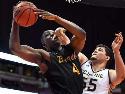 Mar 10, 2017; Anaheim, CA, USA; Long Beach State 49ers forward Temidayo Yussuf (4) gets fouled by UC Irvine Anteaters center Brad Greene (55). Robert Hanashiro-USA TODAY Sports