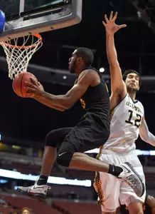 Mar 10, 2017; Anaheim, CA, USA; Long Beach State 49ers guard Barry Ogalue (13) shoots the ball against UC Irvine Anteaters center Ioannis Dimakopoulos (12). Robert Hanashiro-USA TODAY Sports